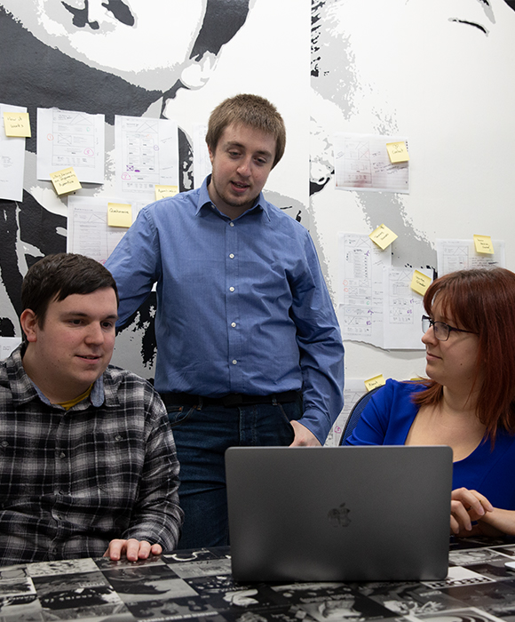 Two developers having a meeting with a content marketer