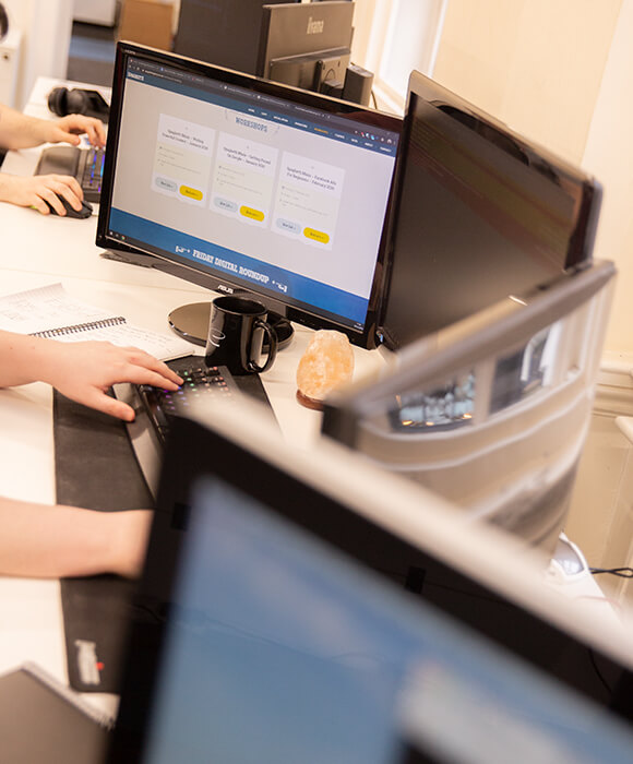 Monitors in a web design office