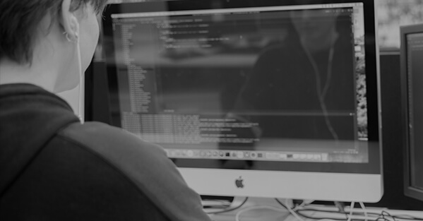 Developer coding on a computer