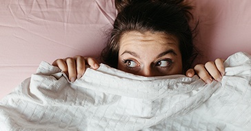 Person hiding under the duvet