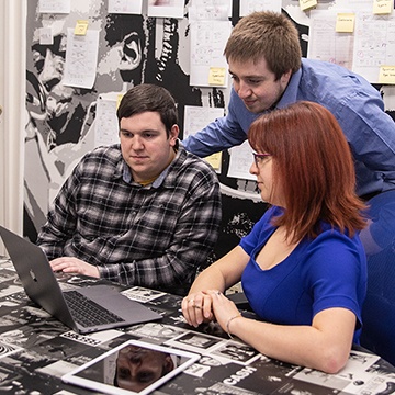Team members discussing a project in a metting